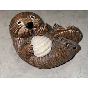 Artesania Rinconada Sea Otter Figurine with shell. Hand Carved Clay Pottery Sign